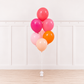 Signature Sunset Sorbet™ Luxury Helium Balloon Bouquet by Cedarwood Events featuring six 11-inch helium balloons in watermelon, hot pink, pink, blush, baby pink, and orange. Balloon pickup in Gloucester, Massachusetts.