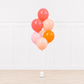 Colorful helium balloon bouquet featuring Signature Aperol Spritz™ themed balloons for luxury celebration events.