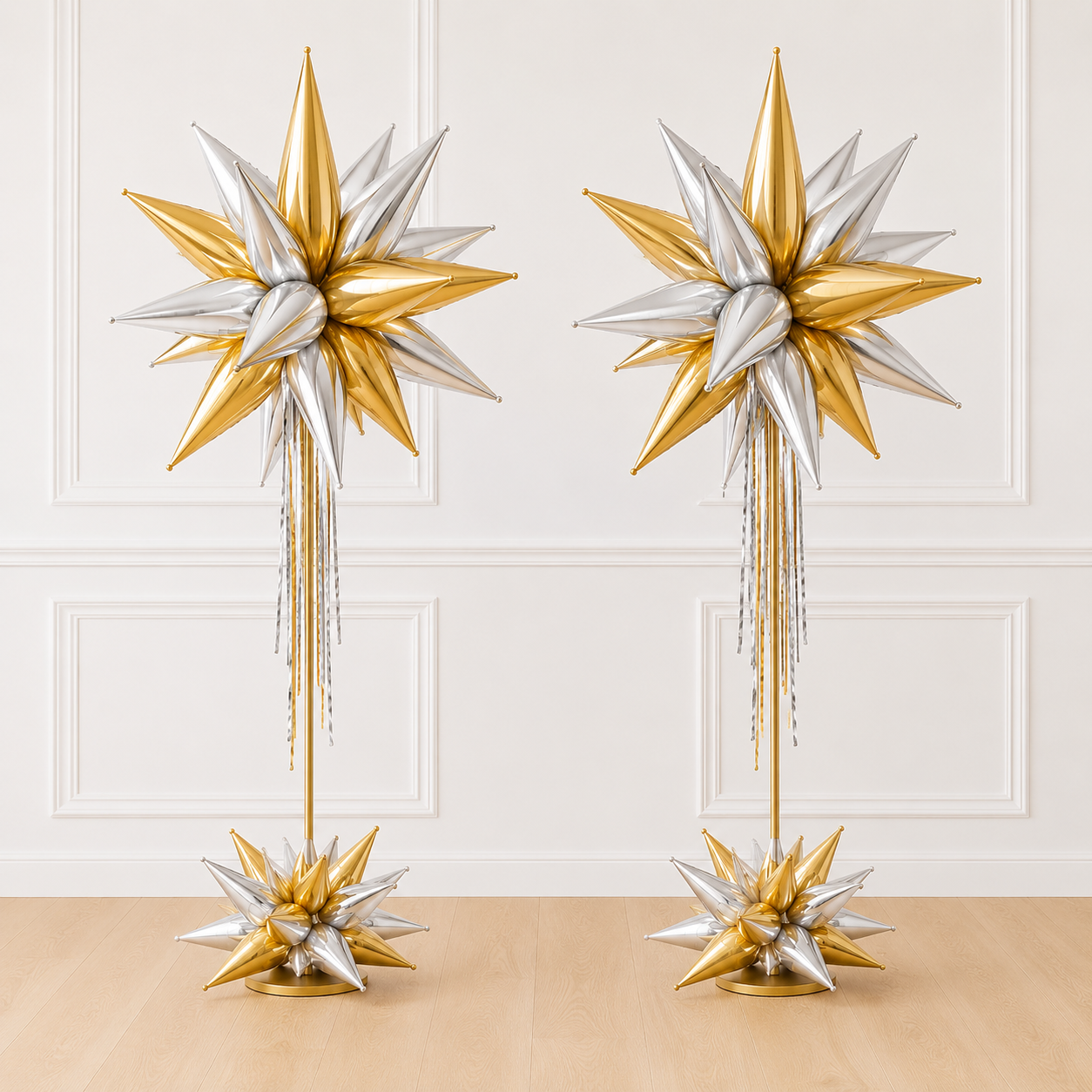 Luxury Signature Starburst Tower™ latex-free balloon columns featuring metallic gold and silver foil starburst balloons. Set of two elegant balloon columns for weddings, galas, grand openings, corporate events, universities, and holiday celebrations.