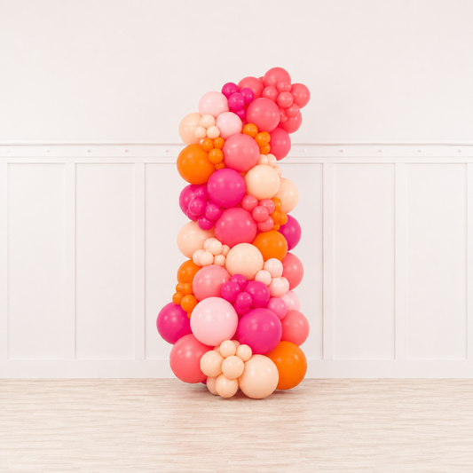 Signature Tropical Sunset™ Grab & Go Balloon Garland featuring watermelon, hot pink, blush, baby pink, and orange balloons by Cedarwood Events. Beverly Hospital Gift. Boston Balloons